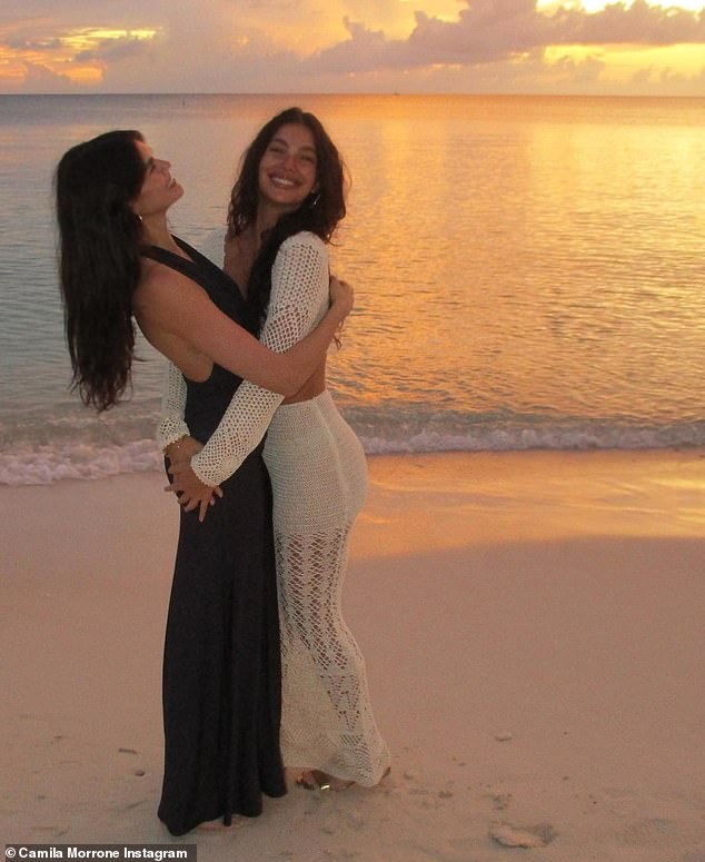 85710769-13494239-Camila_Morrone_26_and_Kaia_Gerber_22_embrace_while_on_the_beach_-m-142_17175...jpg