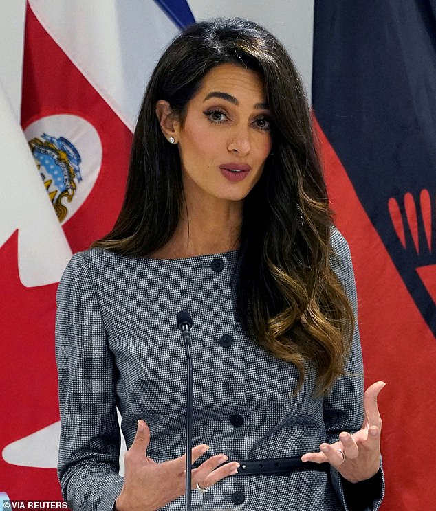 86510651-13564269-Amal_Clooney_a_renowned_human_rights_lawyer_was_named_as_one_of_-a-2_1719318...jpg
