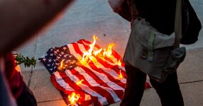 Protesters burning the American flag.jpg