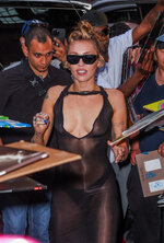 608053050_mileycyrussheerdressbackhotel238.jpg