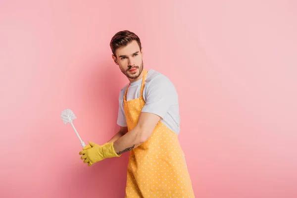 depositphotos_343548254-stock-photo-concentrated-young-man-apron-rubber.jpg